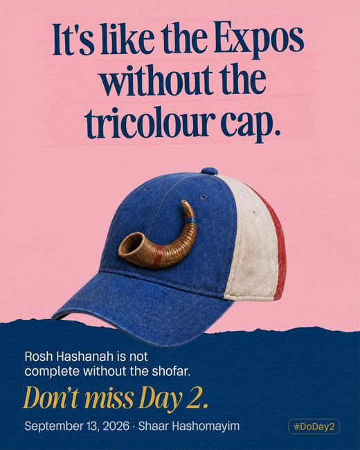 A blue, white and red Expos cap with a shofar curled across the front where the logo would be.