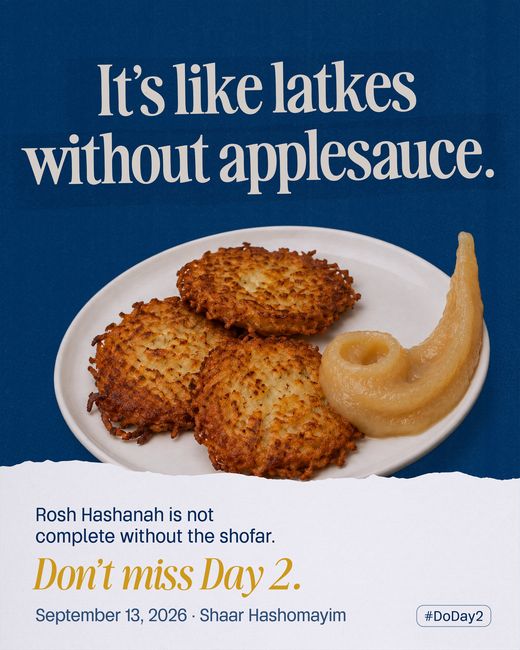 Three latkes on a plate beside a spoonful of applesauce moulded into the curve of a shofar.