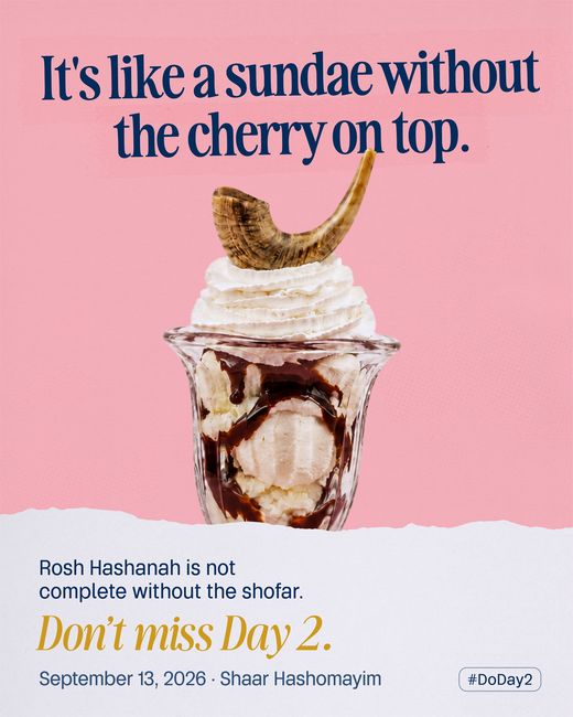 An ice cream sundae in a fluted glass, a ram’s horn standing where the cherry should be on the whipped cream.