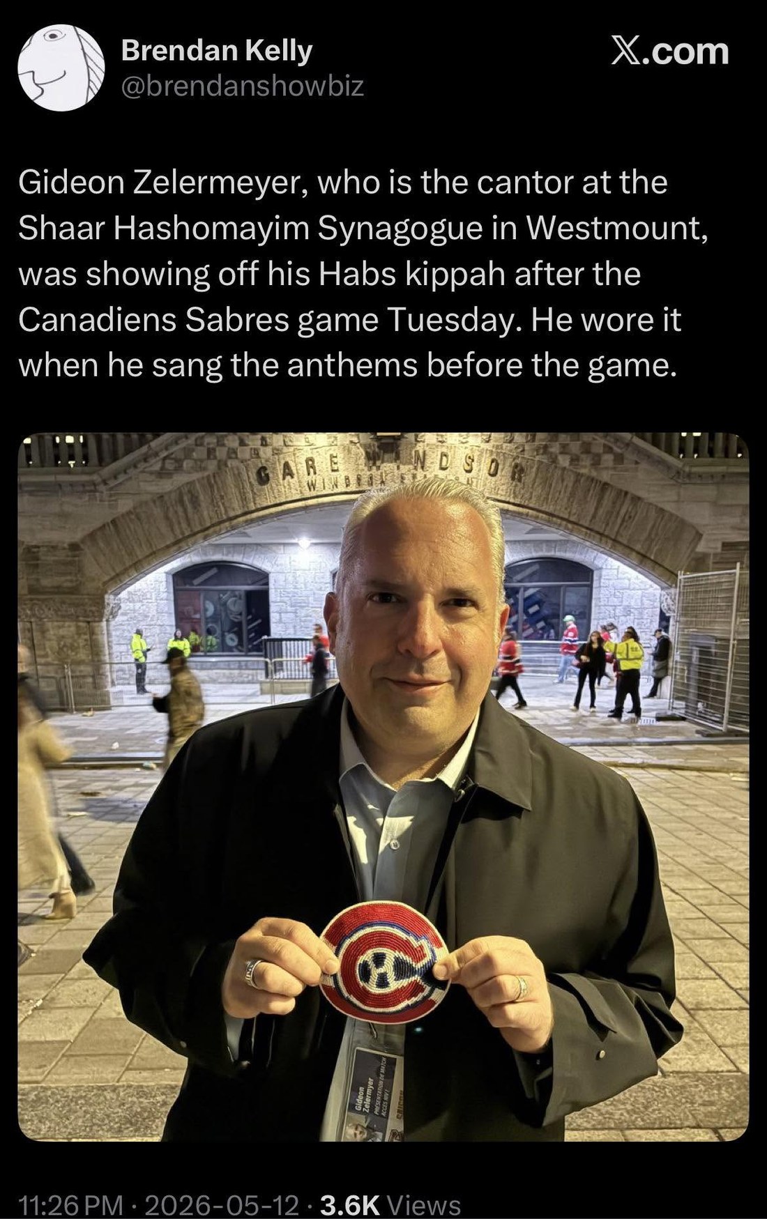Screenshot of a post by Brendan Kelly: Gideon Zelermyer, who is the cantor at the Shaar Hashomayim Synagogue in Westmount, was showing off his Habs kippah after the Canadiens Sabres game Tuesday. He wore it when he sang the anthems before the game. Below, a photograph of Zelermyer outside Windsor Station holding a beaded kippah in the Canadiens colours.
