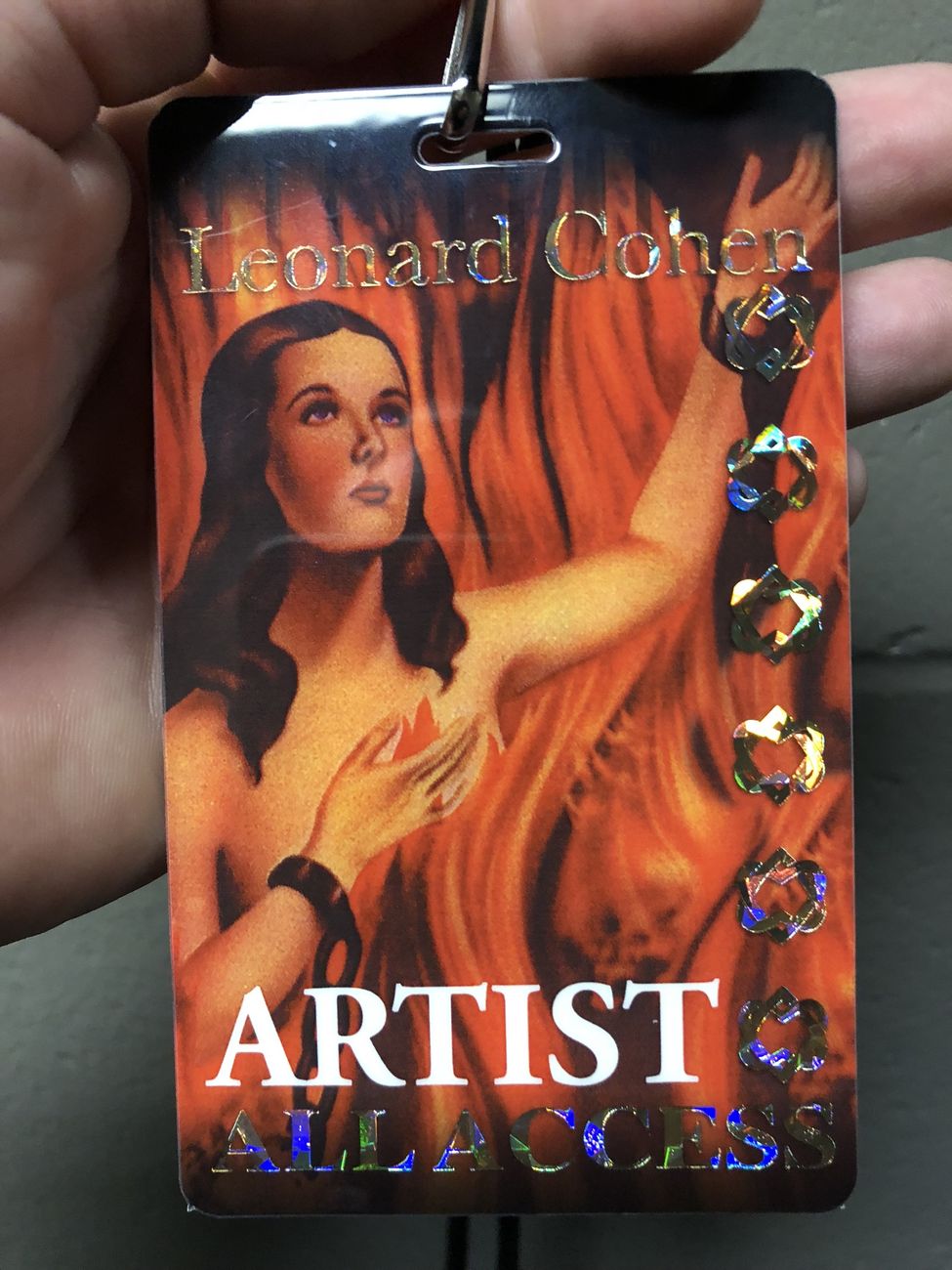 A laminated all-access pass reading Leonard Cohen, ARTIST, ALL ACCESS, over the cover art of Death of a Ladies' Man.