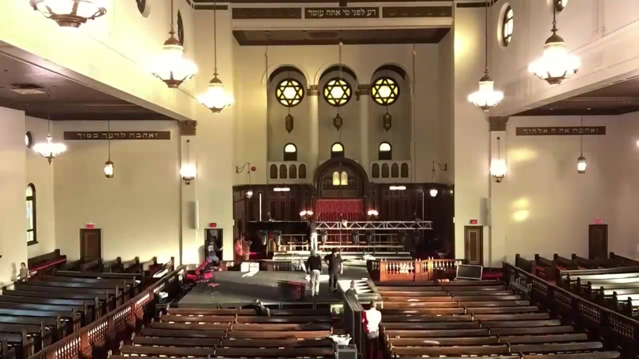 The Shaar Hashomayim sanctuary mid-conversion, a temporary stage built out over the bimah.